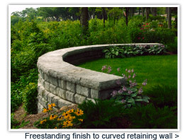 Freestanding blocks finish retaing curved wall 